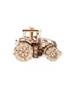 A wooden model tractor on a white background. Podgląd zdjęcia produktu