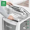 A person is feeding a stack of documents into a LEITZ shredder. Voir les images du produit