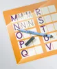 A close-up of a Staedtler Lumocolor correctable marker on a learning board with letters. Anteprima dell’immagine prodotto