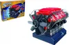 A model of a V8 engine with lights and a fan, shown next to its packaging. Produktbild-Vorschau