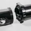 A close-up view of two black cylindrical components of a solar shower, designed to connect. Produktbild-Vorschau
