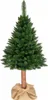 A full shot of an artificial Christmas tree with a wooden trunk, standing on a white background and wrapped in burlap at the base. Voir les images du produit