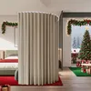 A bedroom decorated for Christmas with a large curtain room divider. Produktbild-Vorschau