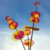 Colorful, translucent discs on sticks against a bright blue sky. Produktbild-Vorschau