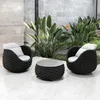 An outdoor seating area with two chairs and a coffee table. Produktbild-Vorschau