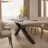 A dining table with chairs set up in a dining room. Produktbild-Vorschau