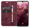 A burgundy flip case wallet for a smartphone is shown open, revealing card slots and a banknote, with the smartphone screen displaying the time and date. Produktbild-Vorschau
