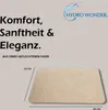 A product image with text and a logo, showing a bath mat with dimensions indicated. Produktbild-Vorschau