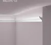 A corner of a room showing crown molding installed at the junction of a wall and ceiling. Produktbild-Vorschau