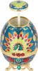 A decorative egg-shaped toothpick holder with a peacock design. Produktbild-Vorschau