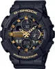 A close-up studio shot of a black and gold Casio G-Shock watch. Voir les images du produit