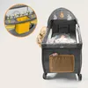 A baby in a playpen with a changing station attached. Podgląd zdjęcia produktu