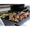 Food being grilled on a grill mat inside a grill. Produktbild-Vorschau