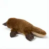 A plush toy platypus lies on a white background. Anteprima dell’immagine prodotto