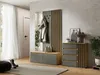 A modern entryway with a coat rack, mirror, bench, and chest of drawers. Produktbild-Vorschau