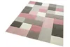 A close-up, angled view of a rug with a geometric pattern. Podgląd zdjęcia produktu