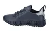 A side view of a single blue sneaker against a white background. Podgląd zdjęcia produktu