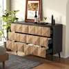 A dresser with geometric wooden drawers in a room setting with a plant and decor on top. Produktbild-Vorschau