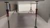 Underneath a large flat surface supported by adjustable poles. Produktbild-Vorschau