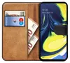A book-style phone case with a Samsung Galaxy A80 phone inside, showing cards and euro banknotes in the case's wallet section. Anteprima dell’immagine prodotto