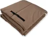 A folded brown cushion or mat with a black strap. Voir les images du produit
