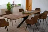 A dining room with a wooden table and chairs. Produktbild-Vorschau
