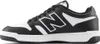 A side view of a black and white New Balance sneaker. Podgląd zdjęcia produktu