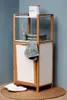 A bathroom storage unit with towels and a decorative item. Produktbild-Vorschau