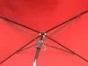 The underside of a red umbrella with its metal frame visible. Produktbild-Vorschau