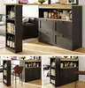 A multi-panel image showing a black and wood bar table with storage, set up in a living room/kitchen area. Voir les images du produit