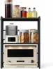 A three-tiered kitchen shelf unit with various items on each shelf, including jars of food, bottles of oil, a food steamer, and a microwave oven. Podgląd zdjęcia produktu