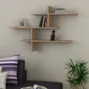 A light wood floating shelf unit mounted on a white wall above a sofa. Voir les images du produit