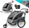 A collage of images showing a child trailer for bicycles, with close-ups of its features and accessories.