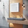 A modern bathroom vanity with a sink, faucet, and a lighted medicine cabinet. Anteprima dell’immagine prodotto