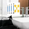 A set of tools for sealing and smoothing, including metal ball tools and silicone caulking tools, displayed in front of a bathroom sink and faucets. Produktbild-Vorschau