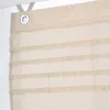 A close-up view of a beige roman blind with horizontal fabric bands. Produktbild-Vorschau