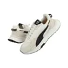 A pair of Puma Wild Rider sneakers are shown against a white background. Podgląd zdjęcia produktu