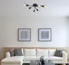 A modern living room with a sectional sofa and a ceiling light. Produktbild-Vorschau