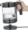 A hand holding a glass electric kettle over its base. Podgląd zdjęcia produktu