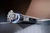 A Philips electric shaver is displayed on a reflective surface, with a blurred background. Podgląd zdjęcia produktu