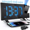 A digital alarm clock with a phone charging on its stand. Produktbild-Vorschau