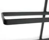 A close-up shot of a black metal wine rack. Náhled obrázku produktu