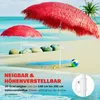 Two red straw beach umbrellas on a sandy beach with the ocean in the background. Produktbild-Vorschau
