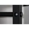 A close-up view of a black metal bar attached to a black metal frame with a silver bolt and a black cap. Produktbild-Vorschau
