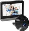 A digital peephole viewer and its camera unit are shown against a white background. The viewer displays a family of four smiling and cheering. Produktbild-Vorschau
