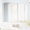 A rectangular mirror is mounted on a tiled wall above a sink. Produktbild-Vorschau