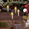 A festive Christmas scene with LED candles, wine glasses, and fruit on a table. Produktbild-Vorschau