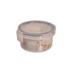 A round, clear plastic food storage container with a blue lid and white clasps, shown against a white background. Produktbild-Vorschau