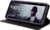 A smartphone in a black flip case is displayed, showing a movie streaming interface on its screen. Produktbild-Vorschau