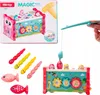 A product shot of a children's toy box with various accessories, including a fishing rod and worm-like toys. Podgląd zdjęcia produktu